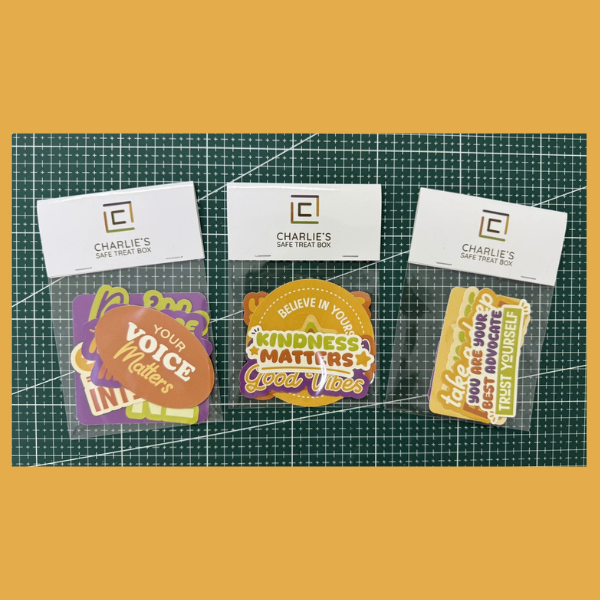Set of motivational stickers with visible text on a grid background