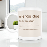 Mug with 'allergy dad' definition on a white surface with a window in the background