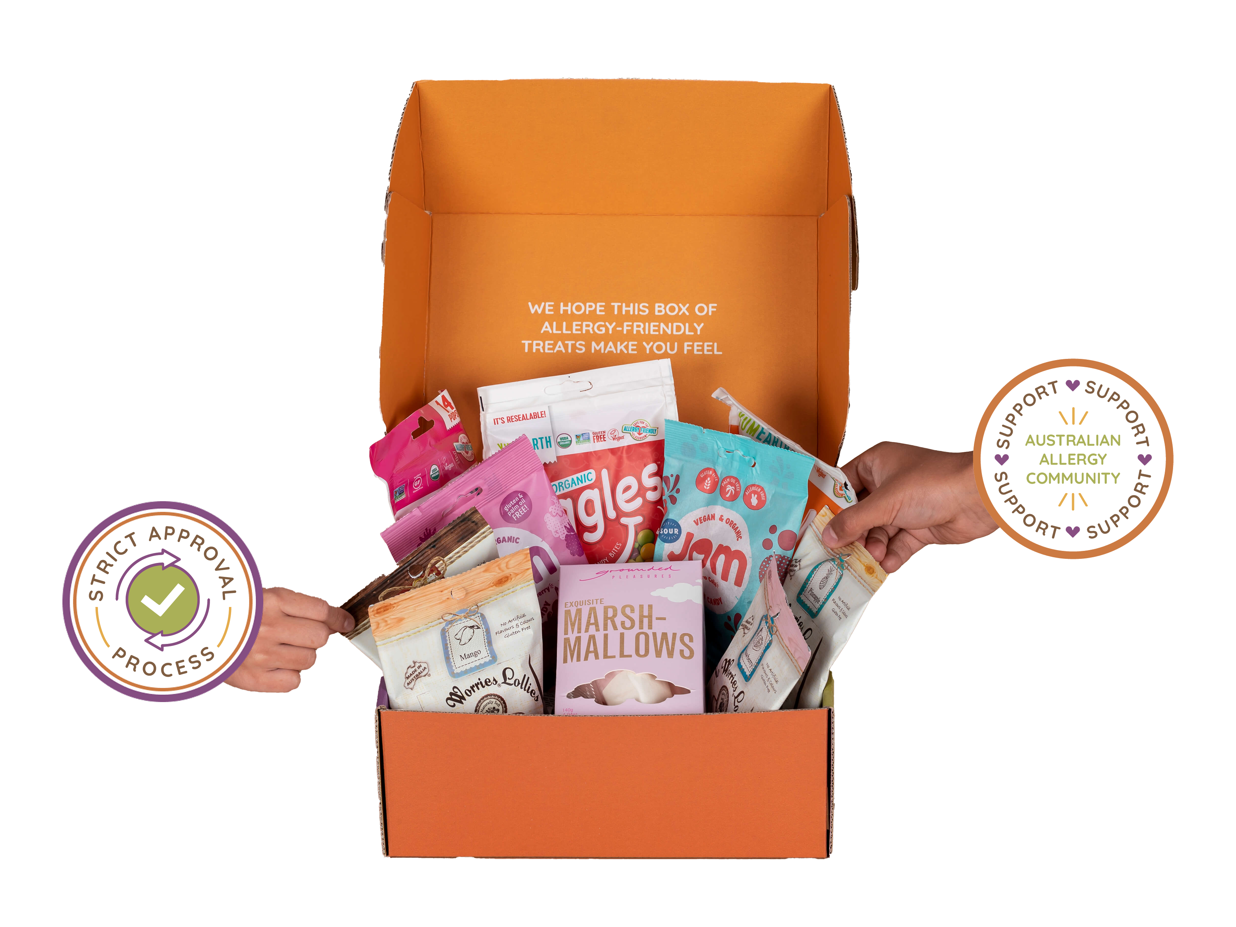 Orange box filled with various snacks, with a hand reaching inside, on a white background.