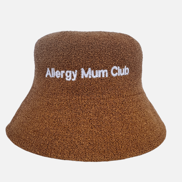 Brown bucket hat with 'Allergy Mum Club' text on a white background