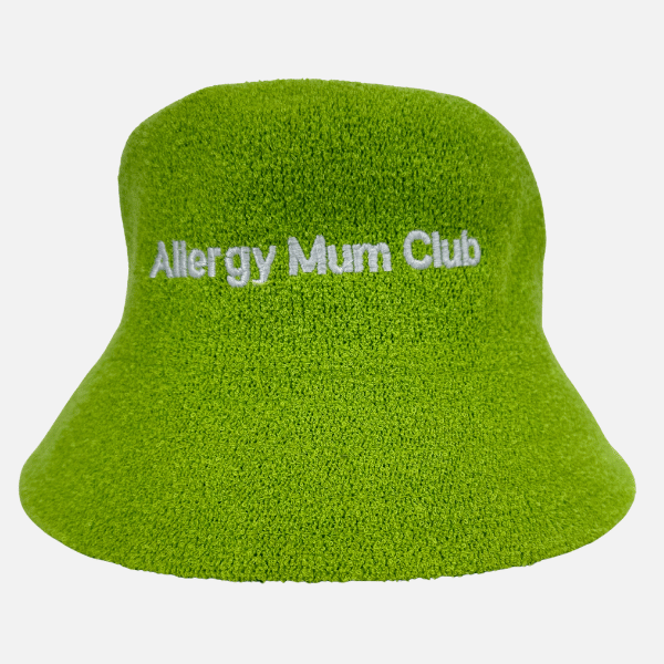 Green bucket hat with 'Allergy Mum Club' text on a white background
