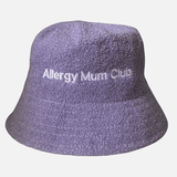 Purple bucket hat with 'Allergy Mum Club' text on a light gray background