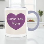 Mug with purple heart and 'Love You Mum' text in a kitchen setting