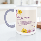 Mug with 'allergy mum' definition and floral design on a white surface