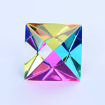 Multicolored crystal prism on a light blue background