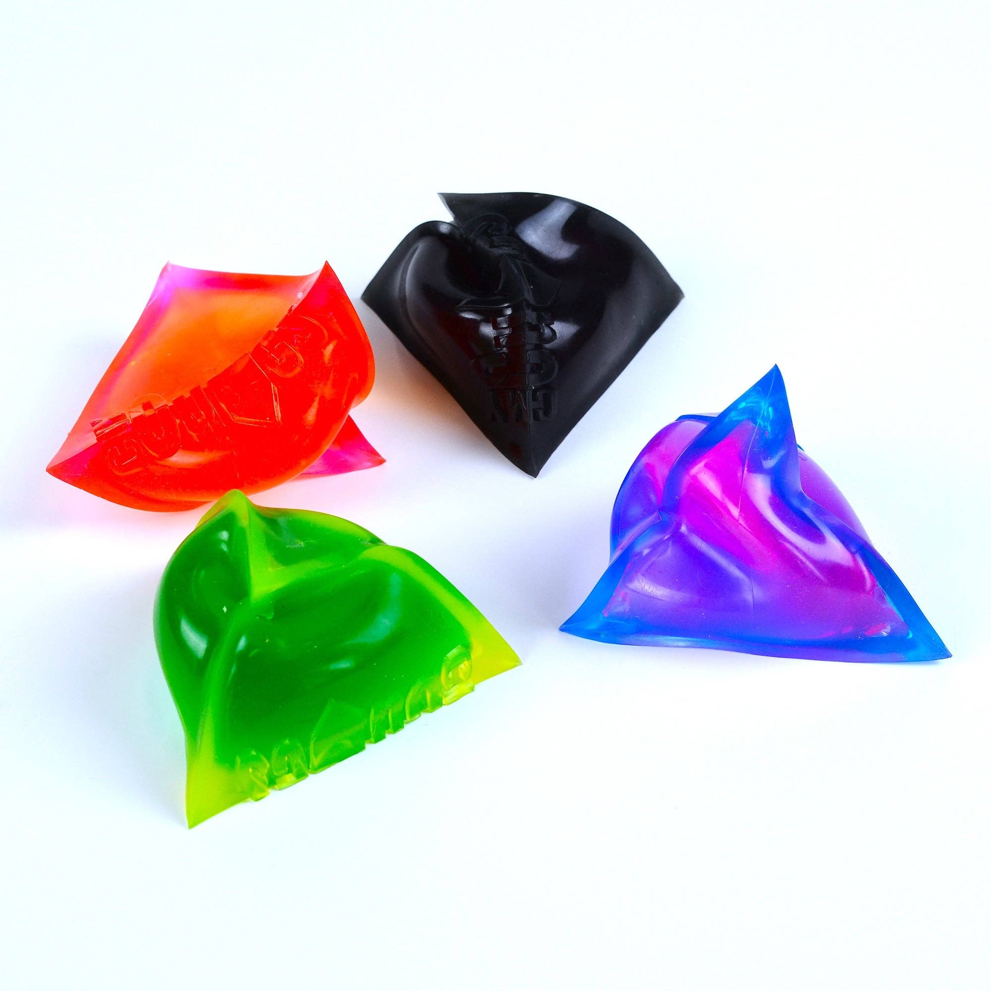 Four colourful triangular objects on a white background