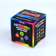 A 3D-rendered or photographed cube-shaped product box for 'Polysquish Discovery Series' by 'Cub65', shown on a plain light gray/white background. The box is mostly black with rainbow gradient edges and colorful printed graphics including geometric shapes and text such as 'Collect Them All' and 'Squish & Squeeze & Discover.
