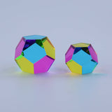 Two colorful geometric shapes on a light gray background