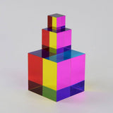 Stack of colorful transparent cubes on a gradient background
