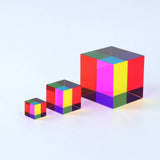 Set of three colorful transparent cubes on a light gray background