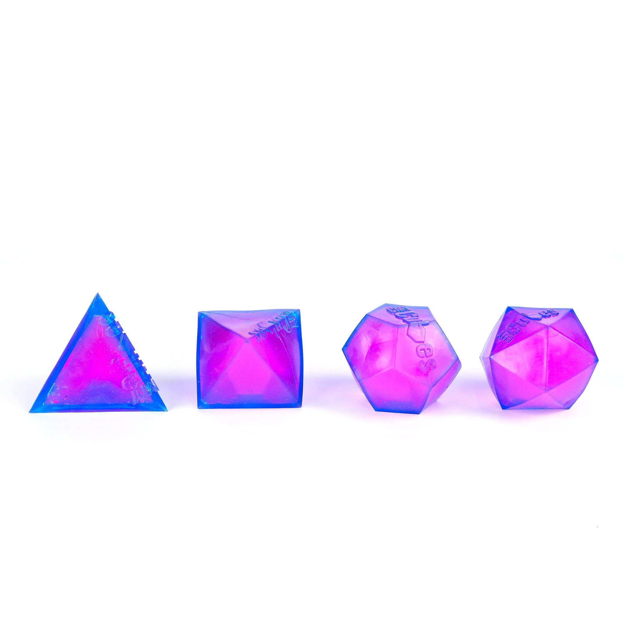 Set of four colorful polyhedral dice on a white background