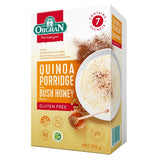 A box of Orgran Quinoa Porridge with Bush Honey, gluten free, containing 7 sachets. The packaging is primarily beige and white with red, green, and orange accents, and features a graphic of a bowl of creamy porridge topped with cinnamon.