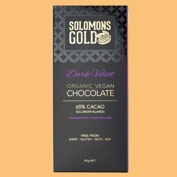 Solomons Gold Dark Velvet Organic Vegan Chocolate packaging on a beige background