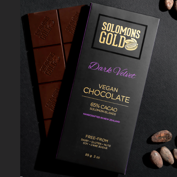 Solomon's Gold Dark Velvet  Vegan Chocolate bar with packaging on a dark background