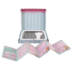 Unboxed toy kitchen set with a pan, tray, and recipe cards on a white background