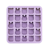 Purple silicone mold with bear-shaped cavities on a white background