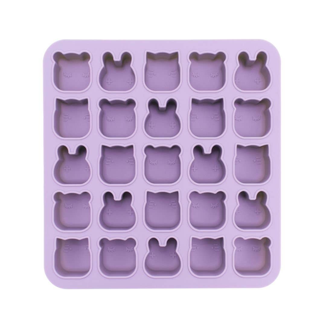 Purple silicone mold with bear-shaped cavities on a white background