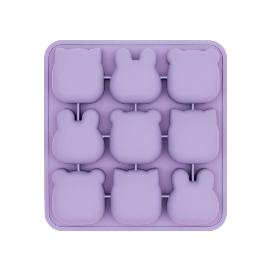 Purple silicone mold with bunny shapes on a white background