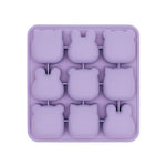 Purple silicone mold with bunny shapes on a white background