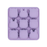 Purple silicone mold with bunny shapes on a white background