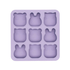 Purple silicone mold with bear shapes on a white background