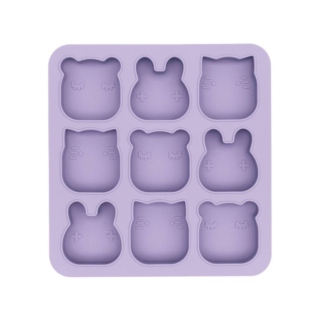 Purple silicone mold with bear shapes on a white background