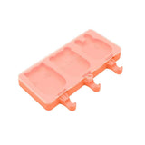 Peach-colored popsicle mold on a white background