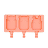 Coral silicone mold with bear, fox, and rabbit shapes on a white background