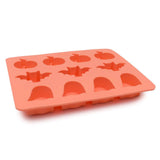Orange silicone mould with Halloween shapes on a white background