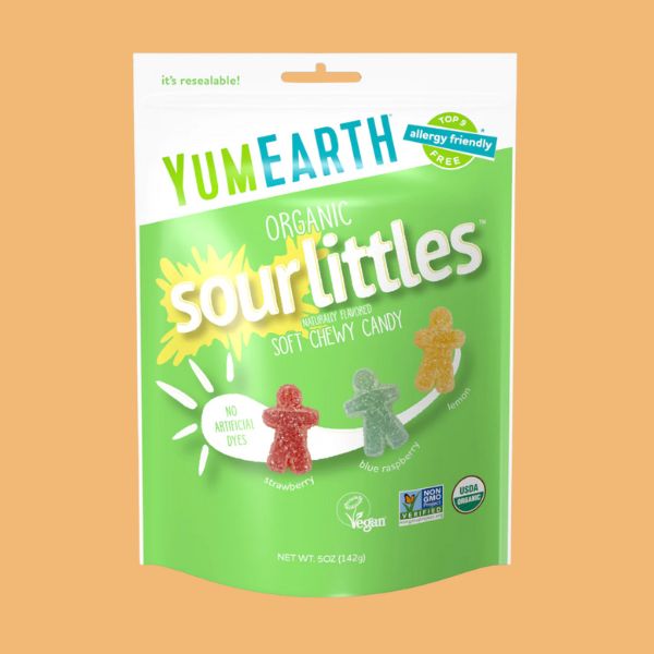 YumEarth Organic Sour Littles candy package on a peach background